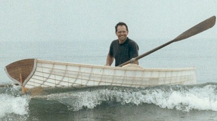 Roger Noble's Classic 12 rowing in the surf